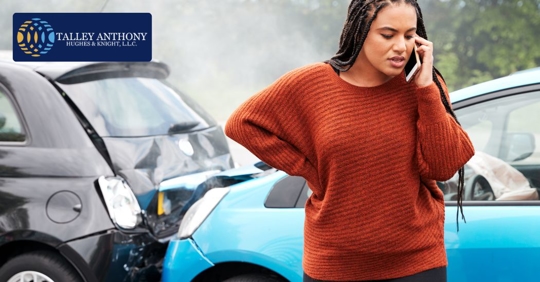 woman calling someone after a car crash